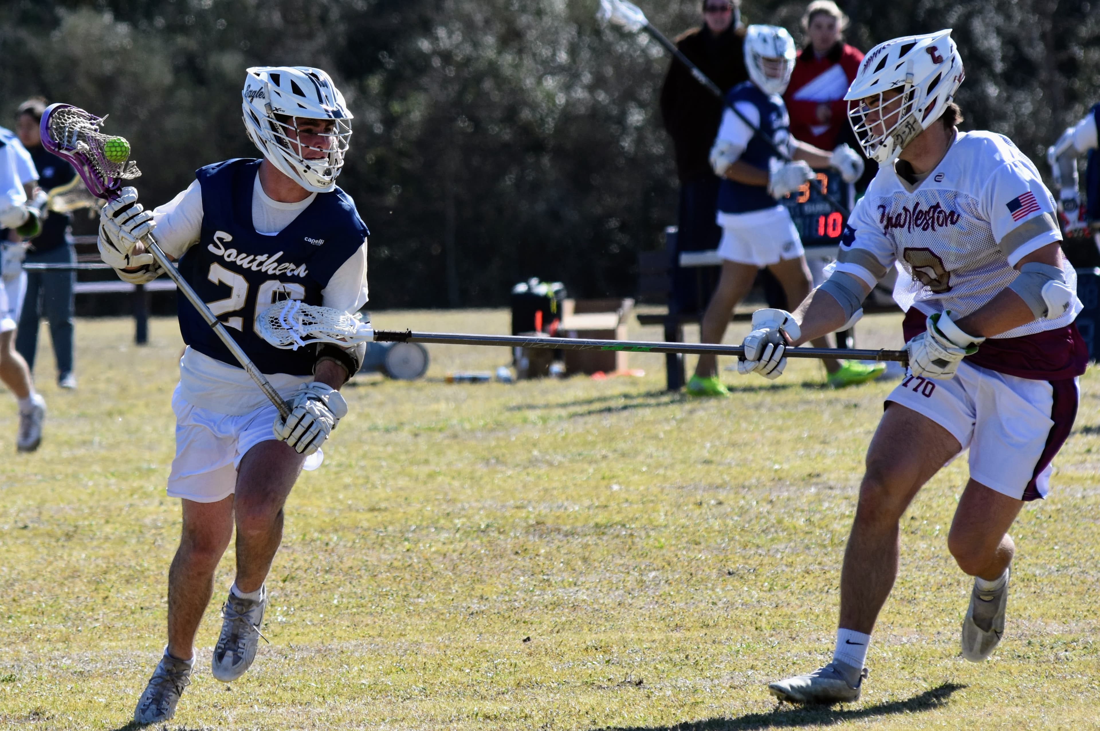 GS #26 driving upfield in the navy Southern jersey